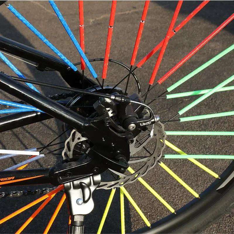 Reflective spoke covers installed on a bicycle wheel for fit and visibility evaluation Reflective spoke covers installed on a bicycle wheel for fit and visibility evaluation